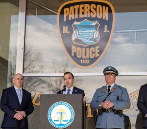 Attorney General Matthew J. Platkin, center, stands with Colonel Patrick J. Callahan, right of center, and other officials during a press conference held by Attorney General Matthew J. Platkin regarding latest efforts to strengthen trust between Paterson Police Department and Paterson Community in front of Frank X. Graves Jr. Public Safety Complex in Paterson on Monday, March 27, 2023.