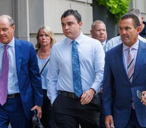 Prosecutors charged Mark Dial, middle, with murder and other charges for shooting and killing Eddie Irizarry while a Philadelphia Police officer.