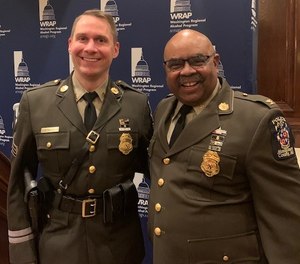 Sgt. Patrick Kepp (left) and Chief Marcus Jones (right) at an awards ceremony in 2021.