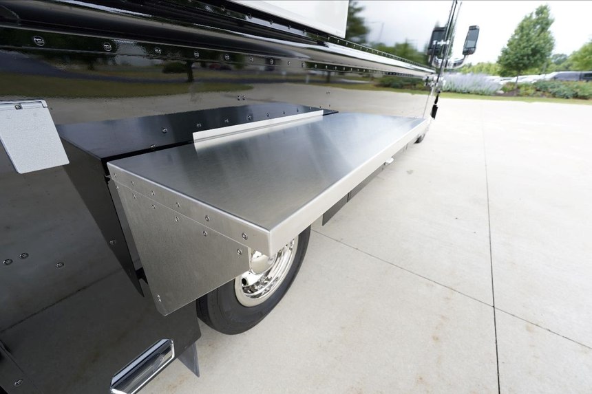 A work table can be added to the exterior. It conveniently folds and can be stored inside the vehicle.