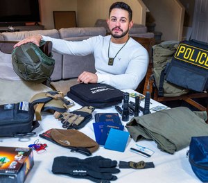 Ariel Salley with all his gear to bring, laid out on his dining room table at home, on Friday, Oct. 20, 2023, in Las Vegas.