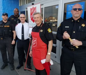 Pictured are RCSD deputies with Salvation Army Major Mark Craddock (white shirt) and Sheriff Leon Lott (red apron), Dec. 202