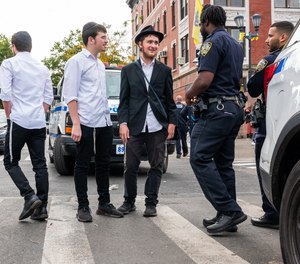 Police patrol a neighborhood in Brooklyn with a large Orthodox Jewish community on Oct. 12, 2023, in New York.