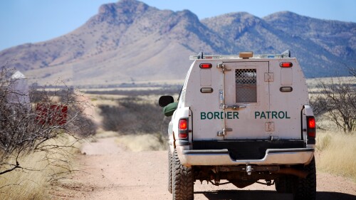 Border patrol truck with Arizona mountains