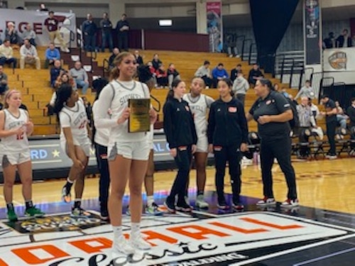 Jordyn Jackson of the Sidwell Friends (DC) girls basketball team poses after winning 