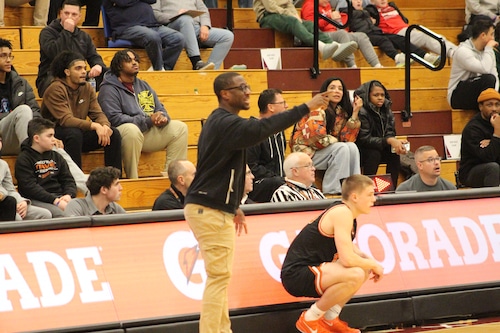 Wasatch Academy boys basketball Head coach Paul Peterson directs his players from the sideline.