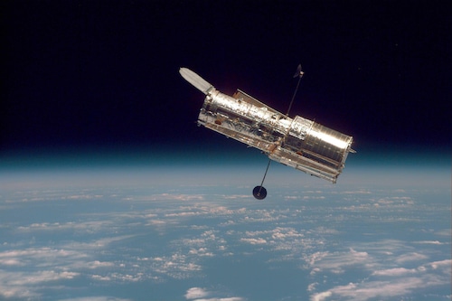 Hubble Against Earth Horizon 1997