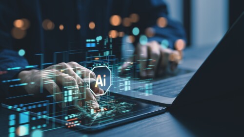 Humans are using laptops and computers to interact with AI, helping them create, code, train AI, or analyze big data with fast, cutting-edge  technology.