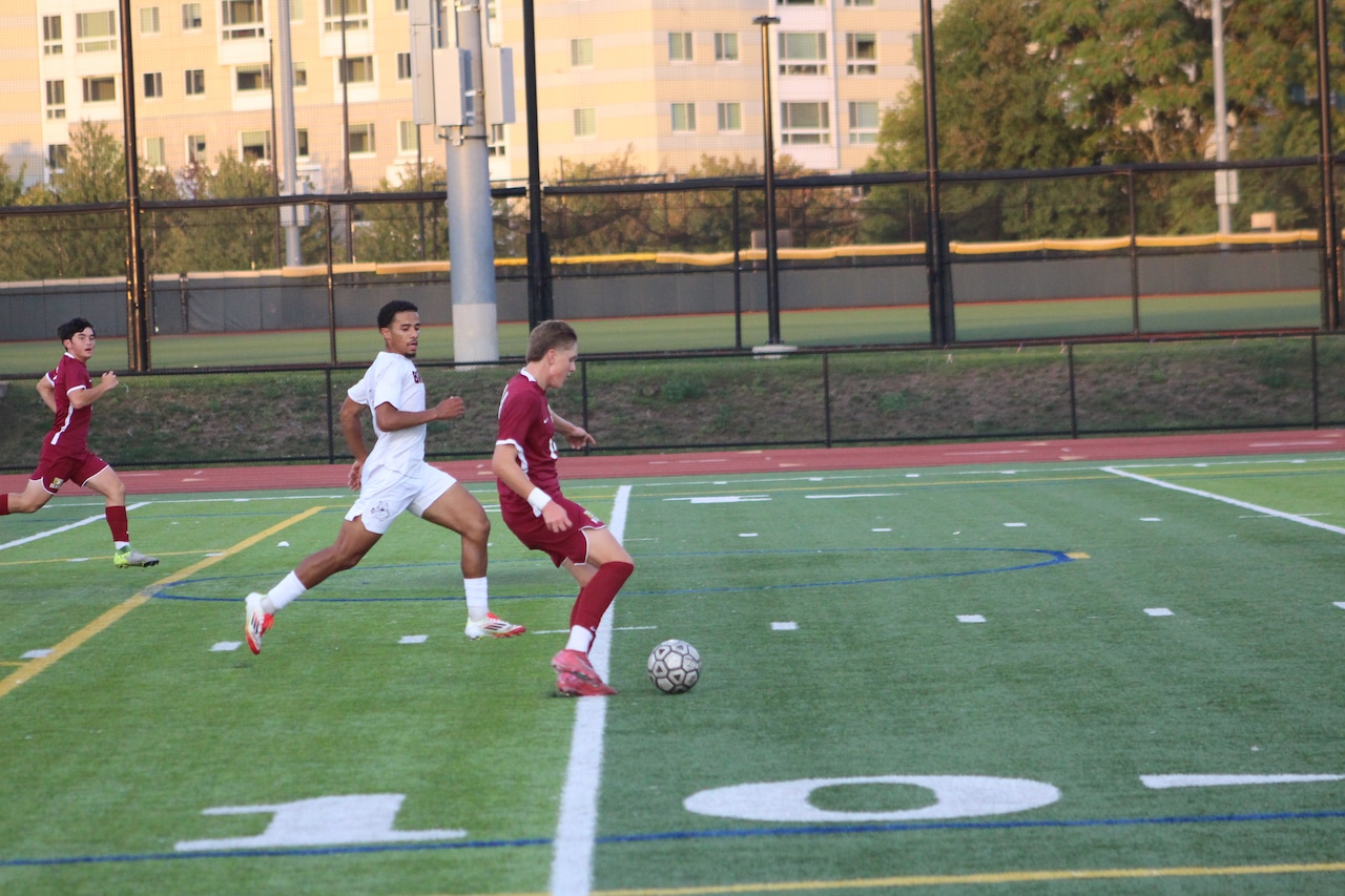 Asher Herrmann plays for BC High boys soccer against Brockton.