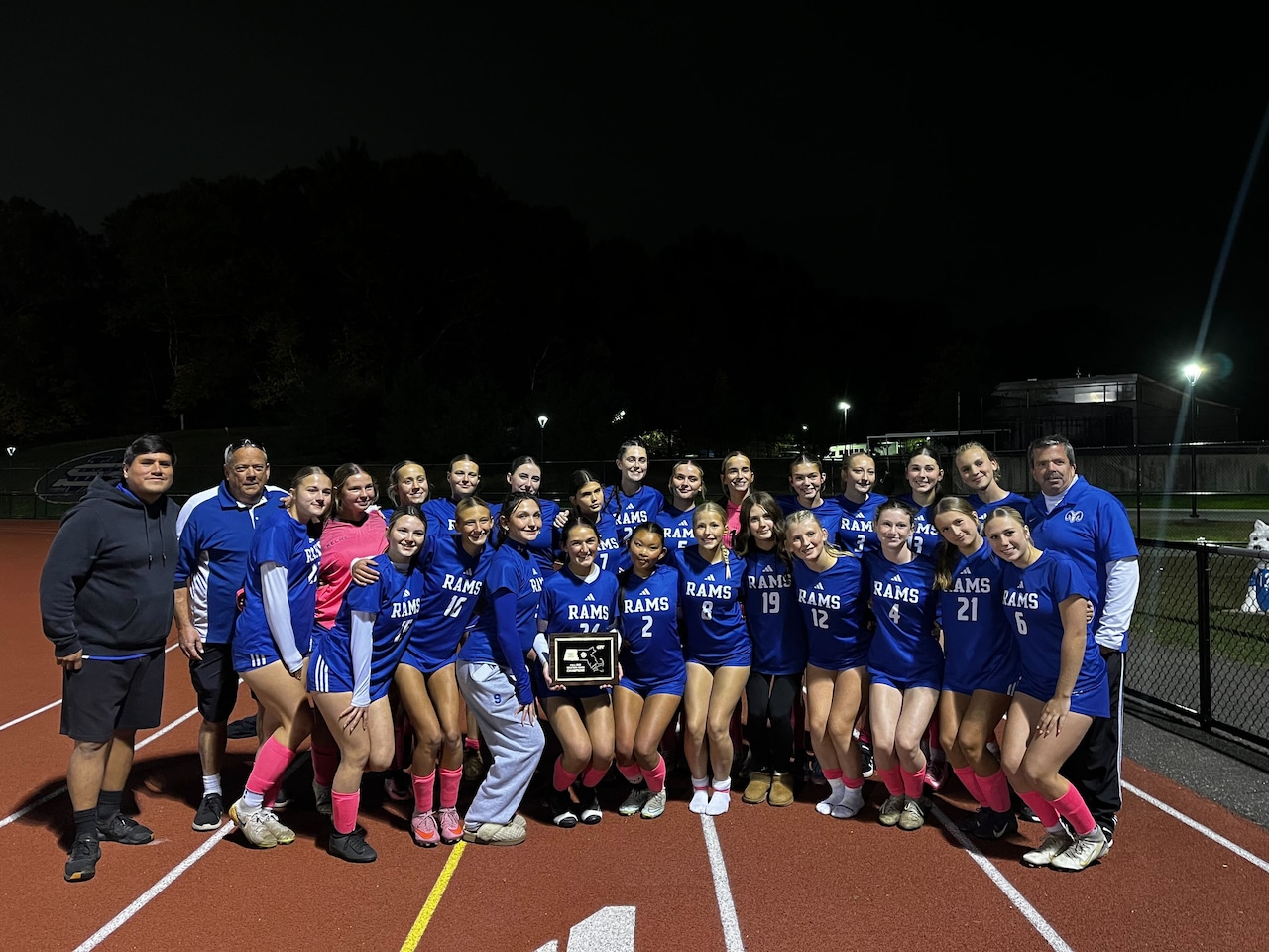 Granby girls soccer poses with their Western Mass. trophy after winning the Class D finals.