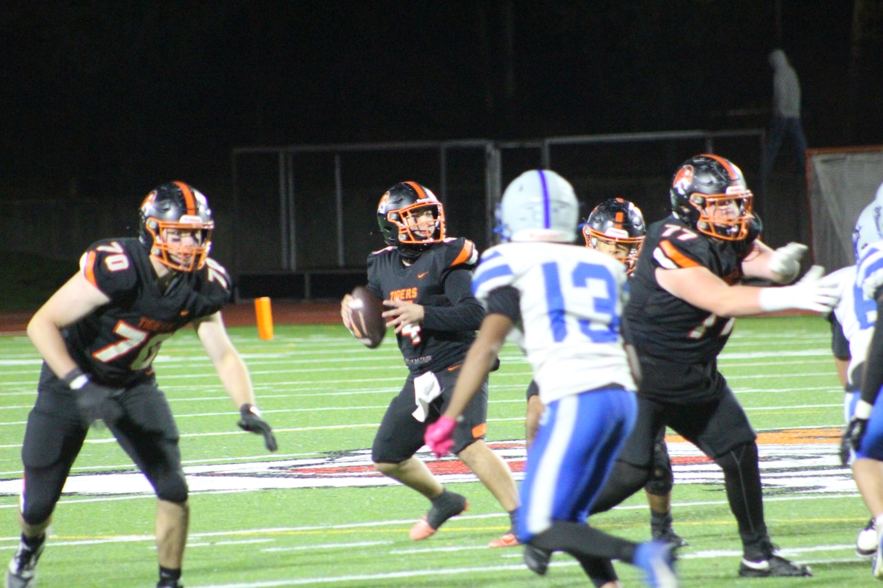 Freddy Torcasio drops back to pass for Newton North football in a win over Braintree.
