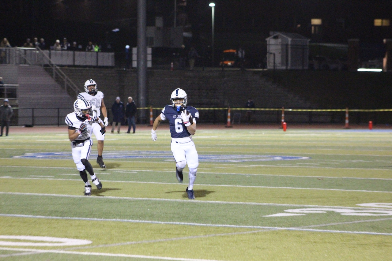 Jordan Toribio runs for a 42-yard touchdown for St. John's Prep in a win over Framingham.