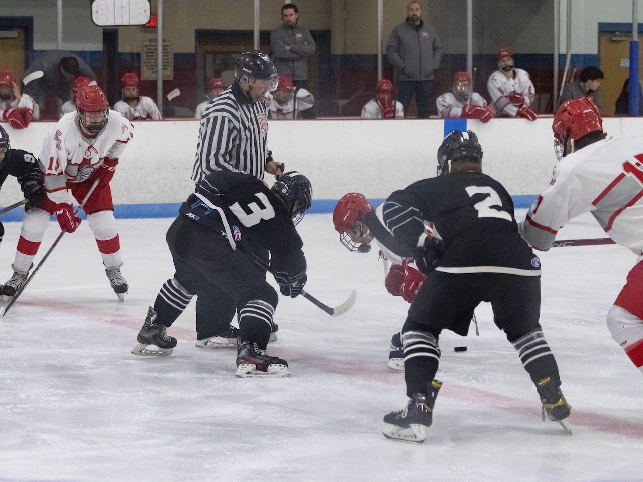 Opening face off between Longmeadow’s Alex Hensch (left) and East Longmeadow’s Mike Mendrala (right) at Olympia Arena on 12/9/23. (Kayla Wong/MassLive)
