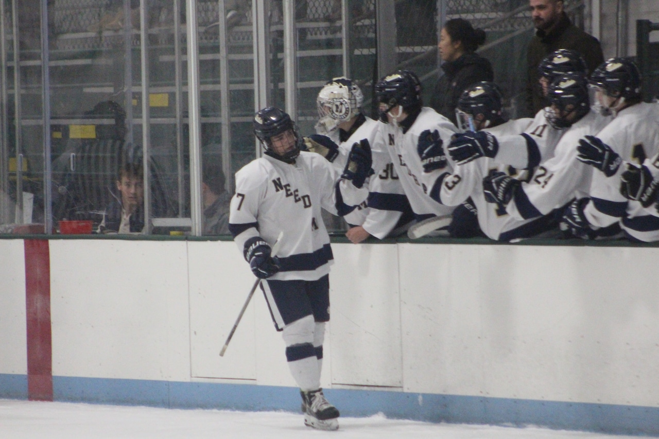Matt Ledbury celebrates scoring for Needham boys hockey against Braintree.